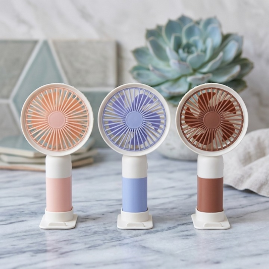 Mini Cute 2-in-1 Handheld Fan with Mobile Stand Base – USB Rechargeable Desk & Personal Fan | Continum
